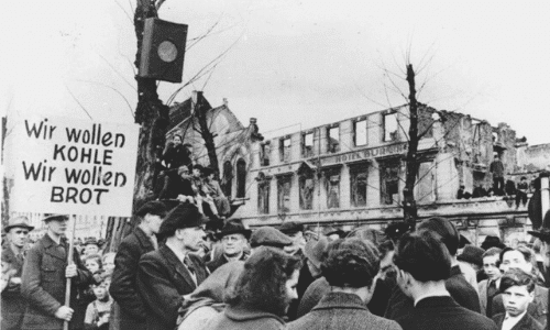 The hunger-winter of 1947, thousands protest in West Germany against the disastrous food situation (March 31, 1947). The sign says: We want coal, we want bread