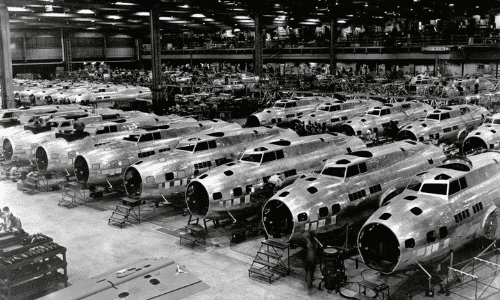 Boeing B-17Es under construction. This is the first released wartime production photograph of Flying Fortress heavy bombers at one of the Boeing plants, at Seattle, Wash. Boeing exceeded its accelerated delivery schedules by 70 percent for the month of December 1942.