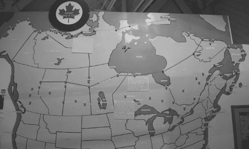 Black and white picture of a map with the Pinetree Radar Line & NORAD