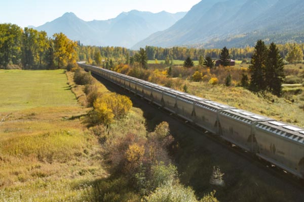 Railcars from Canpotex carrying potash across Canadian landscape