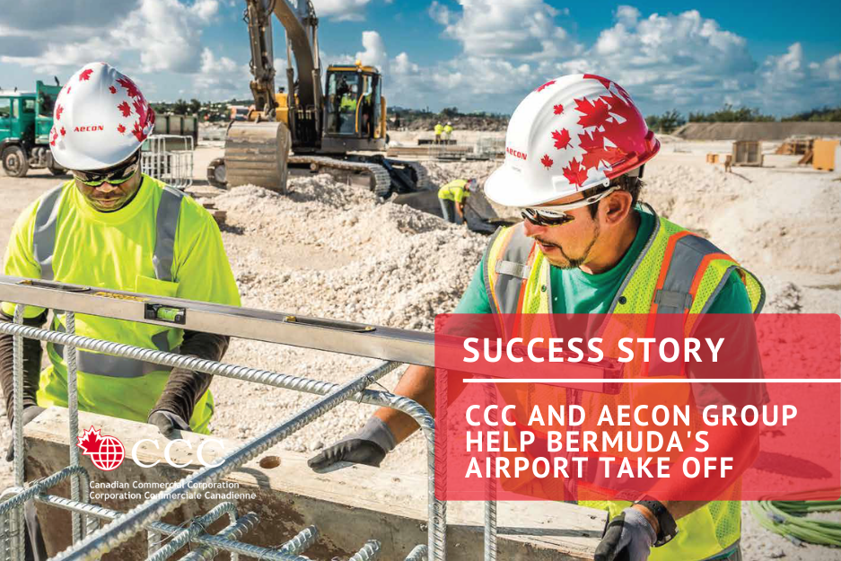 Image of construction site with two workers and heavy machine in the background