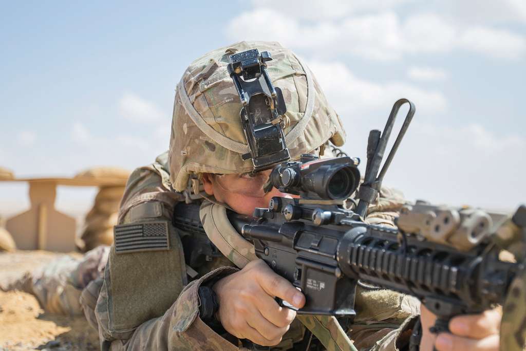 U.S Army Staff Sgt. Bryan Fox, an infantry squad leader, assigned to Company A, 1st Battalion, 155th Infantry Regiment, 155th Armored Brigade Combat Team, Task Force Spartan, pulls security during a rehearsal for a combined live-fire exercise