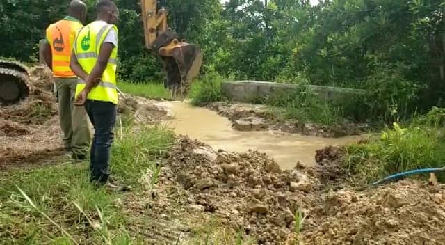 Barbados Water Authority staff inspecting site being dug for water infrastructure