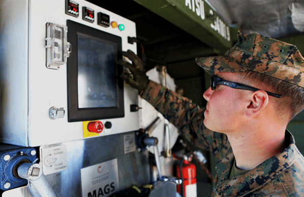 A Marine configures the MAGS compact waste disposal system by Terragon