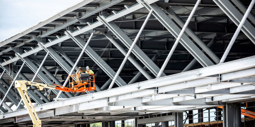 Ferihegy Airport Expansion in Budapest, Hungary. Constructio men inspecting steel infrastructure